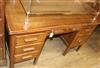 An oak six drawer desk W.137cm                                                                                                         