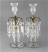 A pair of Regency cut glass table lustres, height 12in.                                                                                