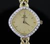 A lady's modern 14ct gold and diamond set Omega quartz dress wrist watch, overall length 18cm.                                         