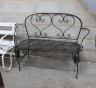 A metal folding garden bench, length 135cm, depth 46cm, height 96cm                                                                                                                                                         