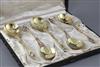 A cased set of four Victorian silver gilt "apostle" serving spoons and matching sifter spoon by Robert Harper, 7.5 oz.                 