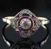 A 1920's gold and platinum, ruby and diamond set cluster ring, size U.                                                                 