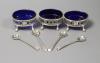 A set of three George III oval pierced silver salts, D & R Hennell, London 1771, 81mm and four bright cut spoons.                                                                                                           