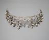 An Edwardian white metal and paste set tiara, 13cm.                                                                                                                                                                         