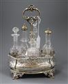 A Victorian embossed silver cruet stand, Roberts & Hall, Sheffield, 1853, with six later associated bottles, height 29.5cm.            