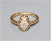 An early 20th century yellow metal and lozenge shaped diamond cluster ring, size M.                                                    