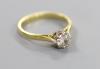 A modern 18ct gold and solitaire diamond ring                                                                                                                                                                               