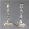 A pair of George III cast silver candlesticks by Ebenezer Coker, 42 oz.                                                                