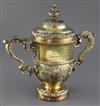 A George II silver gilt two handled presentation cup and cover by Thomas Whipham, 70.5 oz.                                             
