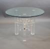 A 1970's German glass top table 107cm diameter, 76cm high.                                                                                                                                                                  