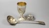 A George III silver fiddle pattern soup ladle, London, 1812, 26.6cm, a Victorian silver goblet, George Angell, London, 1871, 13cm and an early Victorian silver mounted glass travelling inkwell.                           