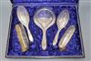 A cased silver dressing table set                                                                                                      