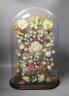 A late 19th century model of porcelain flowers under a glass dome 52cm total height                                                                                                                                         
