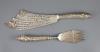 A cased ornate pair of Victorian silver fish servers, Aldwinckle & Slater                                                                                                                                                   