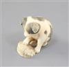 A Japanese walrus ivory netsuke of a puppy, 19th century, height 3.3cm                                                                 