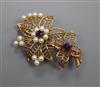 A 9ct gold, amethyst and cultured pearl set floral brooch, gross 7.9 grams.                                                            