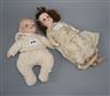 An A.M. open mouthed bisque headed doll and a baby doll                                                                                