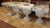 A set of four reconstituted stone urns, height 36cm, diameter 42cm                                                                     