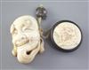 A Japanese ivory noh mask netsuke and an erotic manju ivory and wood netsuke, late 19th / early 20th century, height 4.7cm and 3.3cm   