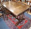 A 1930's oak draw leaf refectory table L.153cm                                                                                         