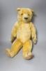 An early 20th century Chad Valley blonde plush teddy bear, length 58cm                                                                                                                                                      