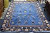 A Chinese dark blue ground carpet 292 x 249cm                                                                                          