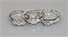 Two 18ct white gold and diamond rings and a platinum and three stone diamond ring.                                                     