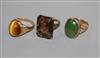 A 9ct gold and quartz dress ring, a similar tiger's eye quartz ring and a 9ct and green cabochon ring.                                 