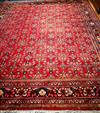 A Persian red ground carpet 400 x 334cm                                                                                                