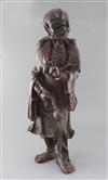 A large Chinese lacquered wood figure of a luohan, 17th/18th century h. 64cm                                                           