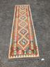 An Anatolian polychrome geometric flatweave Kilim runner, 290 x 84cm                                                                                                                                                        