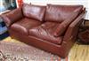 A brown leather drop end knole settee W.195cm                                                                                          