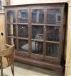 A large carved oak display cabinet W.200cm                                                                                             