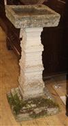 A reconstituted stone garden bird bath H.84cm                                                                                          