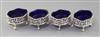 A set of four George III pierced silver oval salts with blue glass liners, by Andrew Fogelberg, 82mm.                                  