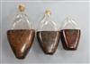 Three 18th century and later leather cased glass flasks, largest 20cm                                                                  