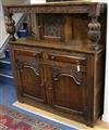 A 17th century style carved oak court cupboard W.141cm                                                                                 