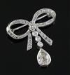 An early 20th century platinum? and diamond drop ribbon bow brooch, width 23mm.                                                        