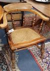 A Victorian cane seat smoker's bow chair                                                                                               