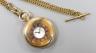A George V 9ct gold half hunter keyless Zenith pocket watch, case diameter 50mm, gross 99 grams, with a gilt metal albert.                                                                                                  