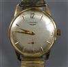 A gentleman's 9ct gold Longines manual wind wrist watch, on associated flexible strap,                                                 