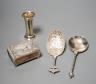 A 19th century Dutch embossed white metal spoon, 13.5cm, one other unmarked white metal spoon, a small silver posy vase and a repousse silver match sleeve.                                                                 