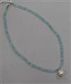 A single strand facetted aquamarine bead necklace, with freshwater pearl drop and 14ct white gold clasp, 35cm.                         