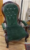 A Victorian mahogany button back open armchair                                                                                         