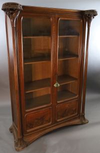 An Art Nouveau walnut and marquetry vitrine by Majorelle, W.5ft D.1ft 10in. H.6ft 7in.                                                 