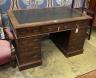 A late Victorian walnut nine drawer pedestal desk, length 122cm, depth 73cm, height 75cm                                                                                                                                    