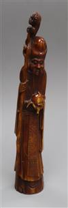 A 19th century Chinese stained marine ivory figure of Shou Lao                                                                         