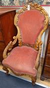 A 19th century French carved walnut showback elbow chair                                                                               