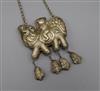 A Chinese white metal pendant on chain                                                                                                 