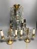 A French boudoir four-light chandelier with clear and amethyst glass pendant drops and a similar pair of French two-light bedside lamps H 57.5cm Dia 36cm                                                                   